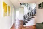 The stairs in this tri level home add beautiful mid century character 